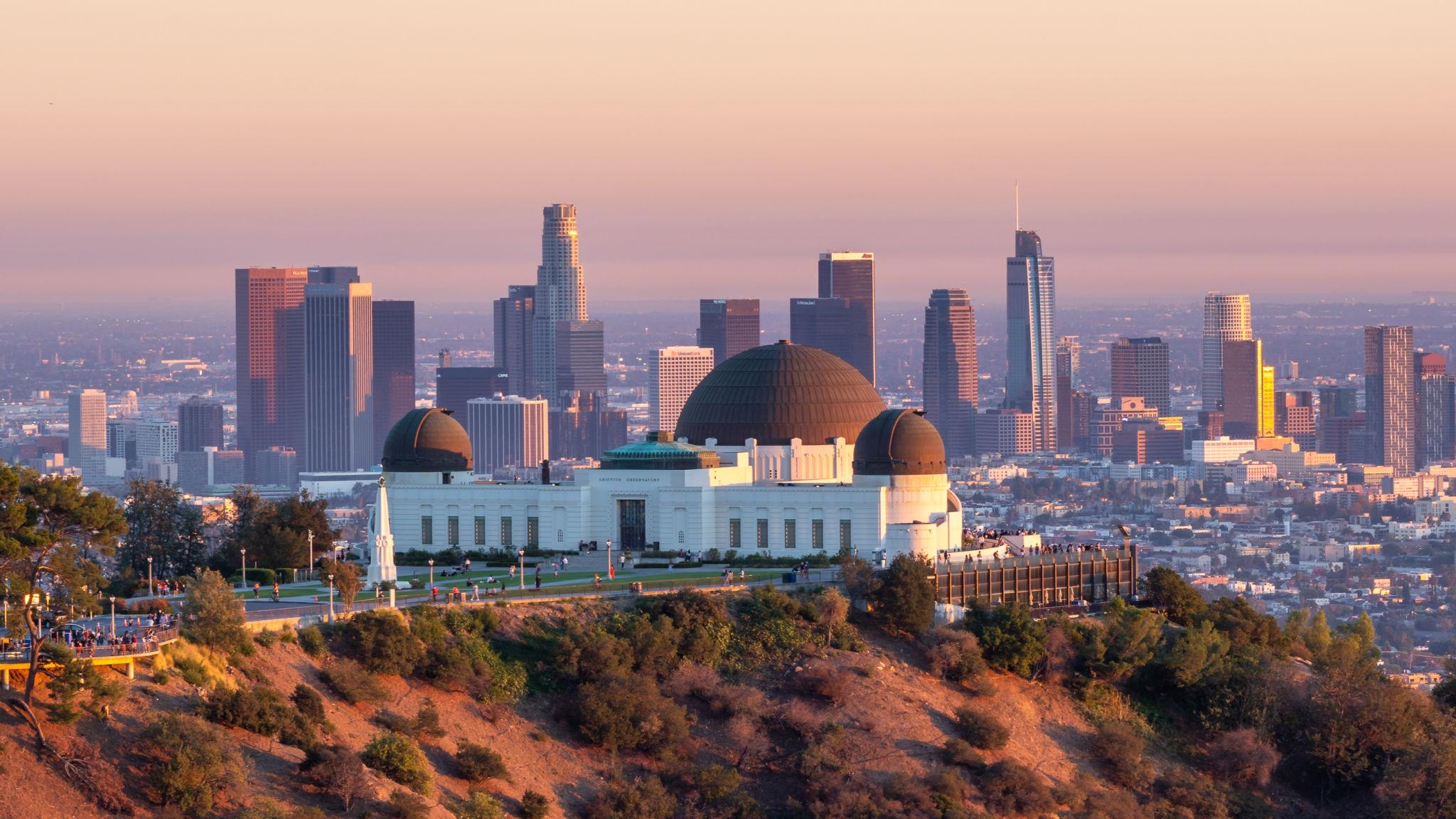 Griffith Observatory and the Los Angeles skyline in warm evening light