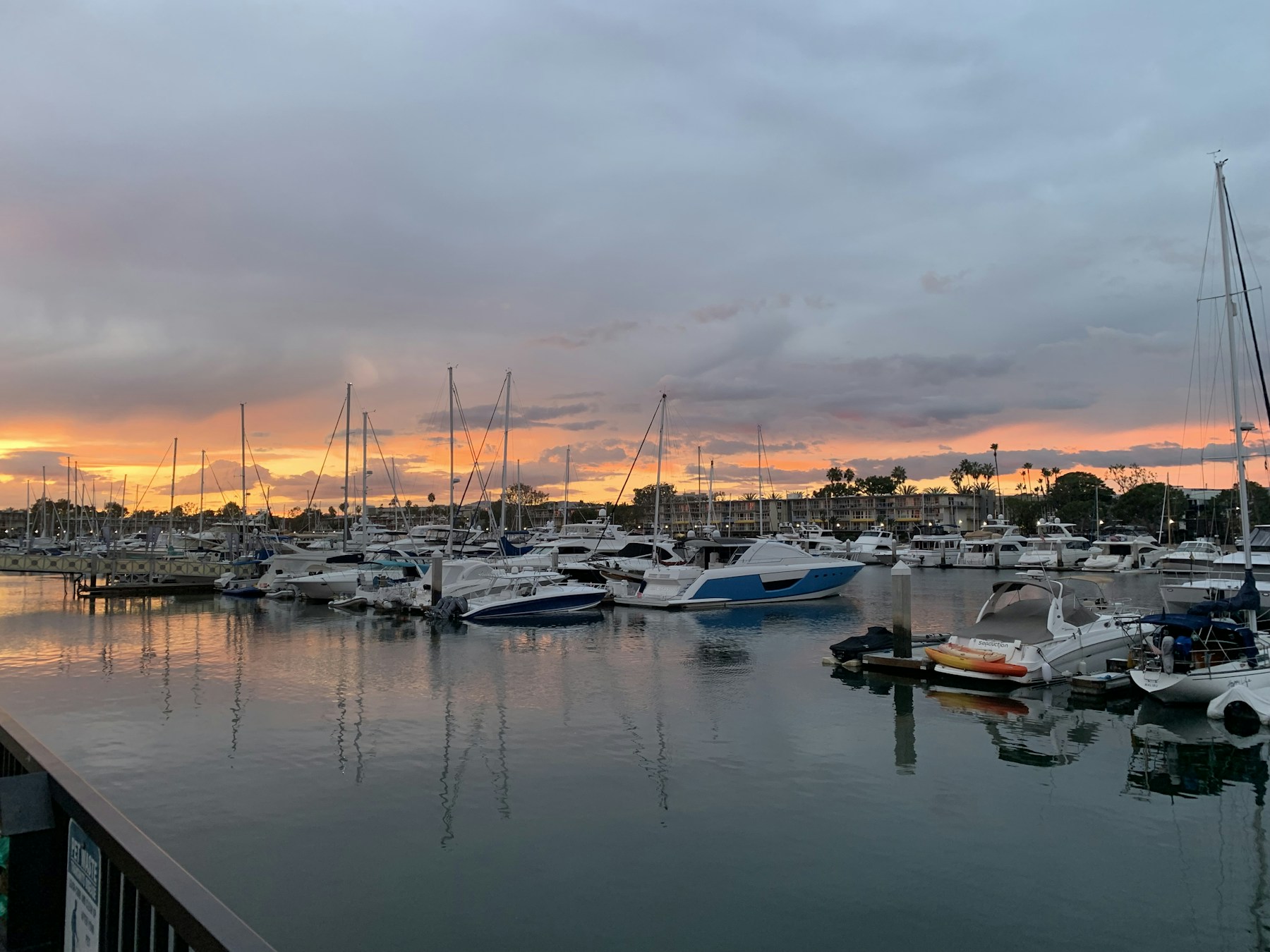 Boats in Marina del Rey harbor at sunset
